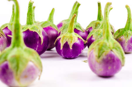 Group of fresh purple eggplant isolated on white backgroundの写真素材