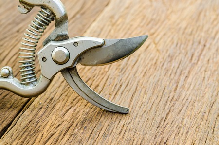 Close up of garden secateurs on old wooden tableの写真素材