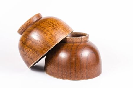 Old wooden bowl isolated on white background