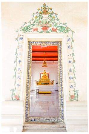buddha statue with old door frameの写真素材