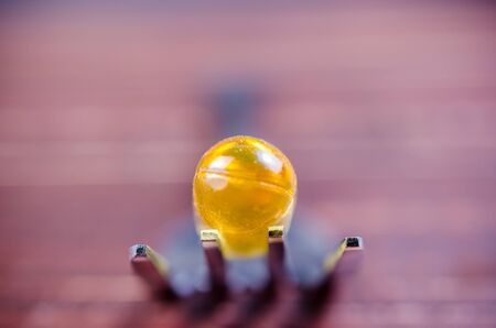 Close up fish oil on silver fork with blue backgroundの写真素材