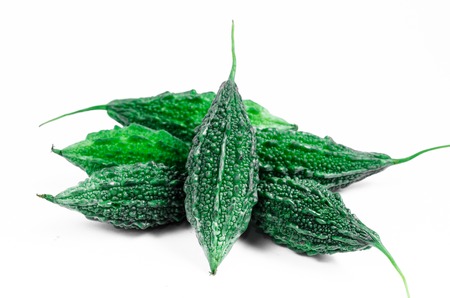 wild bitter gourd, Balsam apple, Balsam pear, Bitter cucumber or Bitter gourd isolated on white backgroundの写真素材