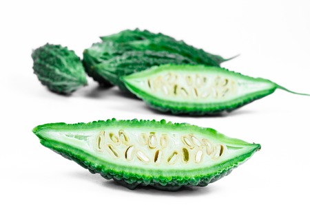 wild bitter gourd, Balsam apple, Balsam pear, Bitter cucumber or Bitter gourd isolated on white backgroundの写真素材