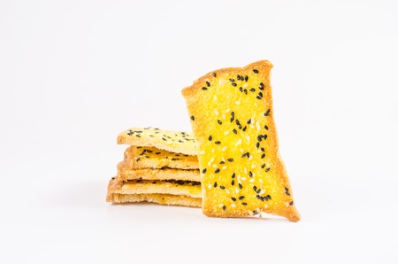 crispbread with margarine and sesame isolated on white backgroundの写真素材