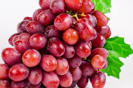 Ripe red grape isolated on white background
