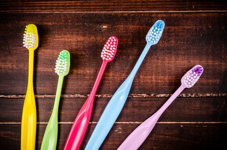 Set of colorful toothbrushs on blackboardの写真素材