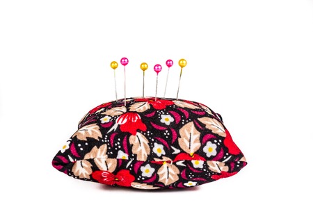 Pincushion with pins isolated on white backgroundの写真素材