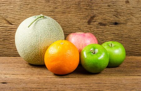 ripe fruit on wooden backgroundの写真素材