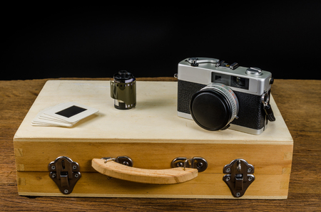 retro camera and photo slide frame with suitcase,concept imageの写真素材