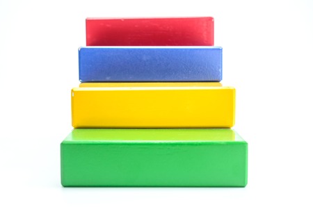 Concept of growth in business,stack of wooden block isolated on white background