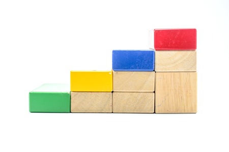 Concept of growth in business,stack of wooden block isolated on white background