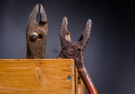 Old carpenter tools isolated on white background,rust pliersの写真素材