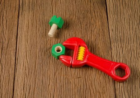 wrench tools toy on wooden boardの写真素材