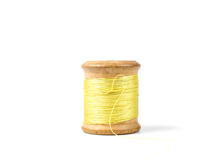 vintage wooden spool thread isolated on white backgroundの写真素材