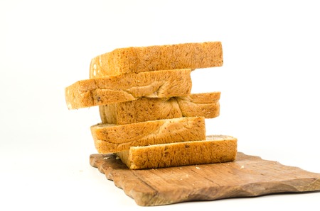 Stack of whole wheat bread isolated on white background