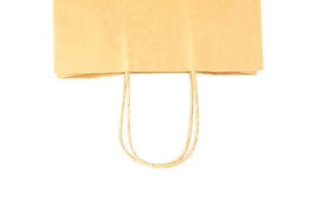Brown paper shopping bag isolated on white backgroundの写真素材