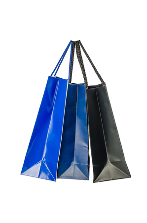 Blue and black paper shopping bag isolated on white backgroundの写真素材