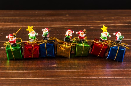 christmas gift box ornament on wooden board backgroundの写真素材