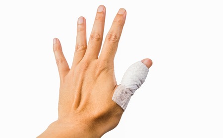 Hand with bandage thumb isolated on white background