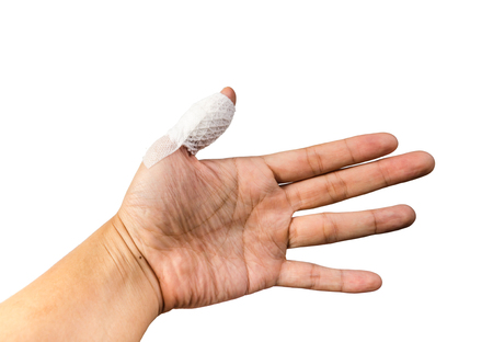 Hand with bandage thumb isolated on white backgroundの写真素材