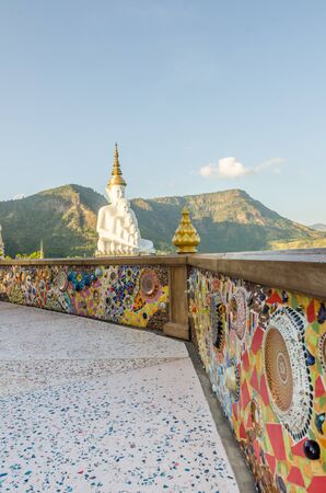 White big buddha statue against mountain at wat phasornkeaw ,Thailandの写真素材