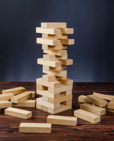 wooden block tower stack game on wooden board backgroundの写真素材
