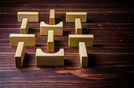 wooden cube blocks shape toy on wooden board backgroundの写真素材