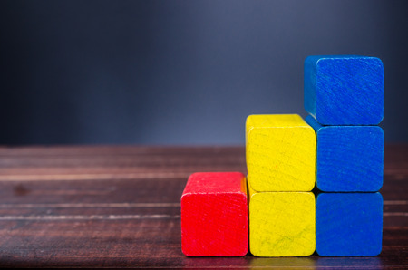 Concept of growth in business,stack of wooden block,bar graphの写真素材