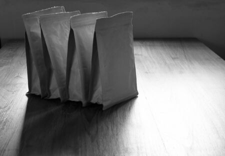 paper zip lock bag on wooden board backgroundの写真素材