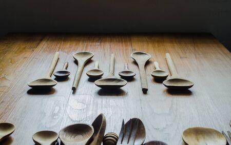 old retro wooden spoon and fork on wooden table backgroundの写真素材