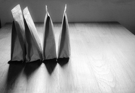 paper zip lock bag on wooden board backgroundの写真素材