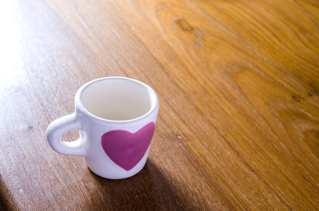White coffee cup on wooden tableの写真素材