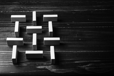 wooden cube blocks shape toy on wooden board backgroundの写真素材