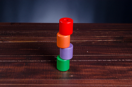 wooden blocks shape toy on wooden board backgroundの写真素材