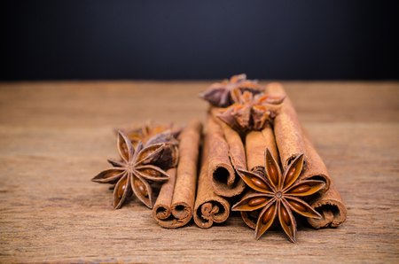 Star anise and cinnamon stick on wooden board background,Chinese star aniseedの写真素材