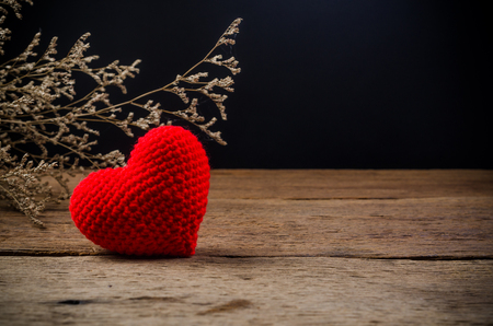 red love heart on wooden board , love valentine day conceptの写真素材