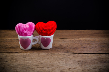 heart in coffee cup on wooden board , valentine concept,の写真素材