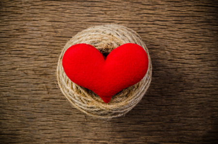 red love heart on wooden board , love valentine day conceptの写真素材