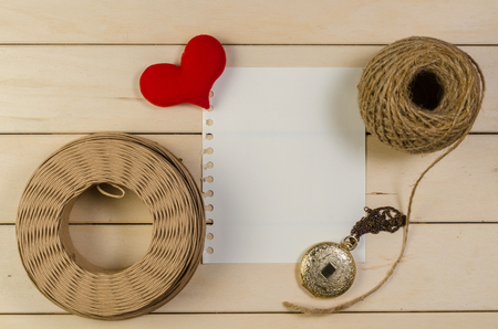 heart shape with blank space and roll of twine cord on wooden board , love valentine day conceptの写真素材