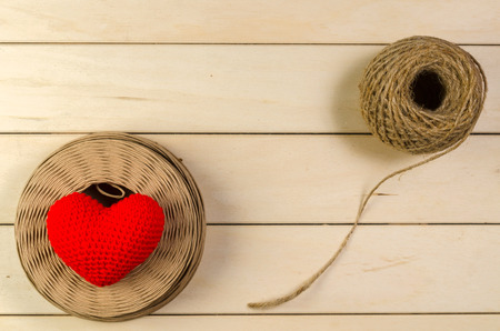 heart shape with roll of twine cord on wooden board , love valentine day conceptの写真素材
