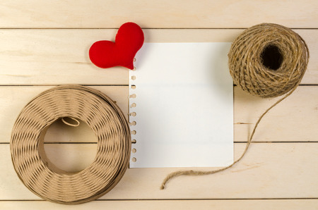 heart shape with blank space and roll of twine cord on wooden board , love valentine day conceptの写真素材