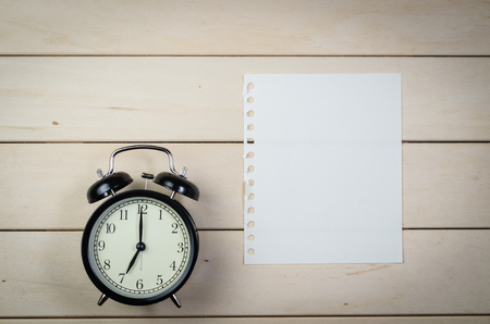 blank notebook with pencil on wooden table, business concept,overtimeの写真素材
