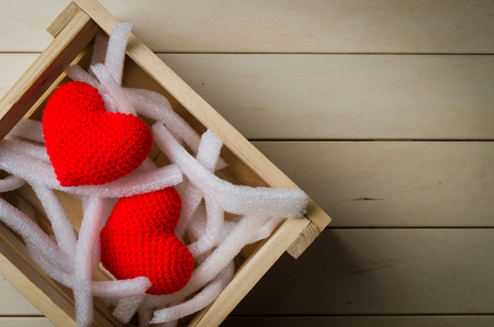 Red heart shape in wooden crate for delivery, valentine conceptの写真素材