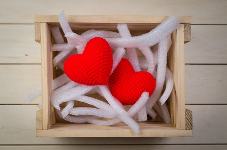 Red heart shape in wooden crate for delivery, valentine conceptの写真素材