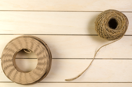 twine cord on wooden board backgroundの写真素材