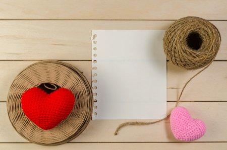 heart shape with blank space and roll of twine cord on wooden board , love valentine day conceptの写真素材