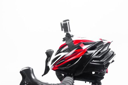 action camera mounted on bike helmet isolated on white background
