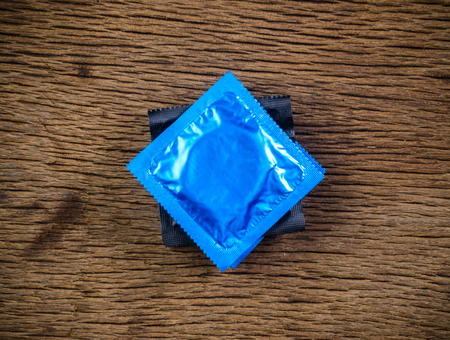 stack condoms on wooden tableの写真素材