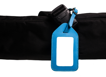 blue leather luggage tag isolated on white backgroundの写真素材
