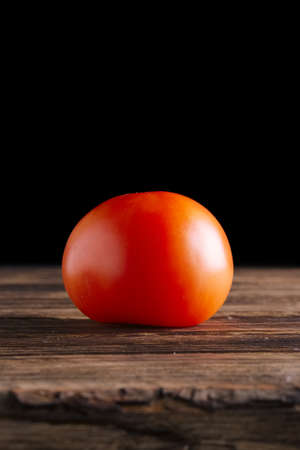 Fresh tomato on wooden tableの写真素材